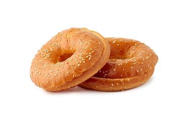 Two fresh sliced bagels on white background