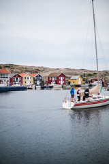 Fototapeta na wymiar Beautiful little town of smögen in sweden, boats, model and flags