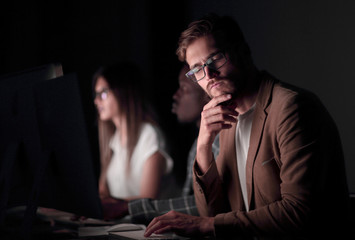 close up.serious businessman in the workplace