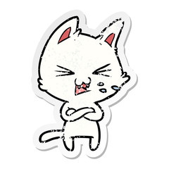 distressed sticker of a cartoon cat with crossed arms