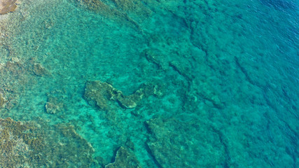 Aerial drone photo of tropical caribbean bay with white sand beach and beautiful turquoise and sapphire clear sea