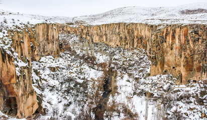 Fototapeta na wymiar Mountains covered with snow in Ihlara Valley, Central Anatolia. Cappadocia, Turkey