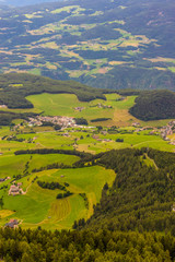 Alpe di Siusi, Seiser Alm with Sassolungo Langkofel Dolomite, a large green field with a mountain in the background