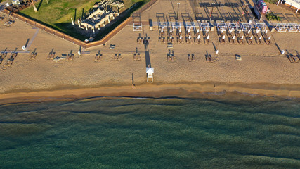 Aerial drone photo of iconic turquoise sandy celebrity beach of Asteras or Astir and ancient temple...