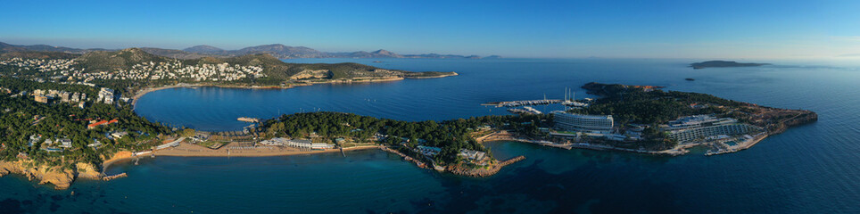 Fototapeta na wymiar Aerial drone photo of iconic turquoise sandy celebrity beach of Asteras or Astir and ancient temple of Apollo Zoster, Vouliagmeni, Athens riviera, Attica, Greece