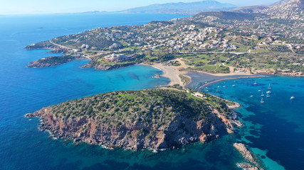 Fototapeta na wymiar Aerial drone photo of famous small islet with picturesque chapel of Agios Nikolaos and small marina, Anavissos area, Attica, Greece