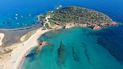 Aerial drone photo of famous small islet with picturesque chapel of Agios Nikolaos and small marina, Anavissos area, Attica, Greece