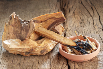 Sacred wood "palo santo" - Bursera graveolens,on rustic wood background