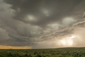 Obraz na płótnie Canvas A dramatic looking severe thunderstorm rumbles close to Black Mesa Nature Preserve at the border of Oklahoma and New Mexico. 