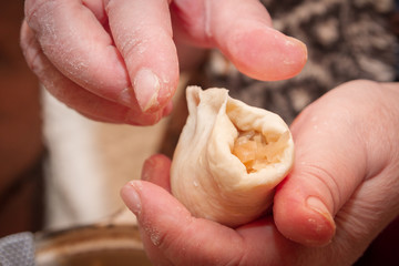 Cooking pies with cabbage in the home of an elderly woman