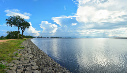Fototapeta na wymiar Beautiful panoramic view of the Tissa Wewa - big artificial lake in Anuradhapura, Sri Lanka