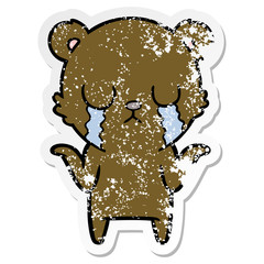 distressed sticker of a crying cartoon bear