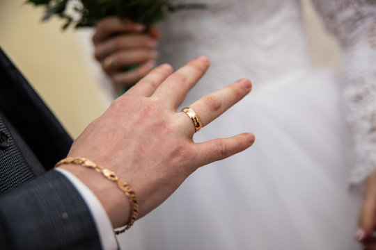 ring on the groom's finger