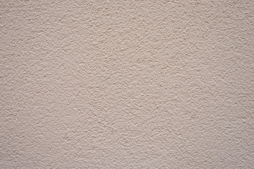 Feine Wand mit Creme-Farbe gestrichen und kontrastarm