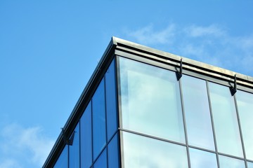 Fototapeta na wymiar Sky reflected in a modern building glass facade