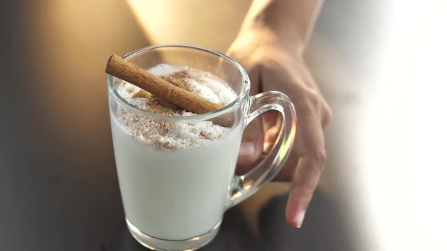 Close up of waitress serving Sachlav- a hot winter drink