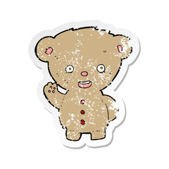 retro distressed sticker of a cartoon teddy bear waving