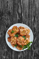 juicy chicken steaks on plate, vertical view