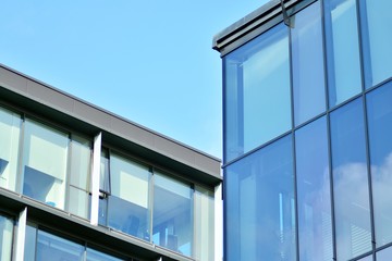 Sky reflected in a modern building glass facade