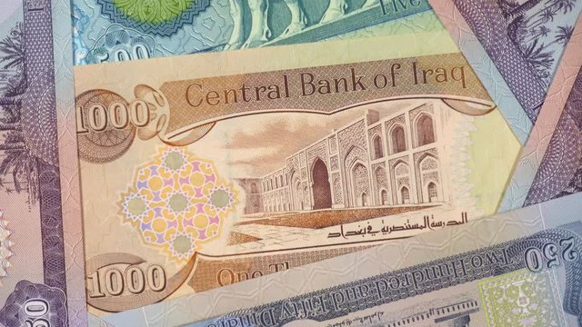 Iraq currency dinar notes rotating. Iraqi money, economy, investment. 4K stock video footage