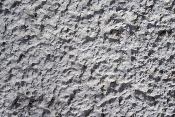 Graue Betontruktur mit harten Kontrasten