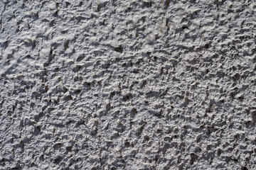 Graue Betontruktur mit harten Kontrasten