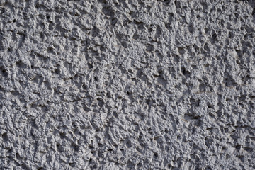 Graue Betontruktur mit harten Kontrasten