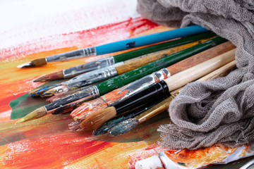 Paint brushes and paints for drawing.