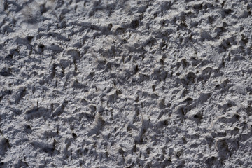 Graue Betontruktur mit harten Kontrasten