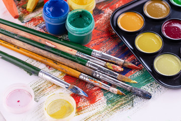 Paint brushes and paints for drawing.