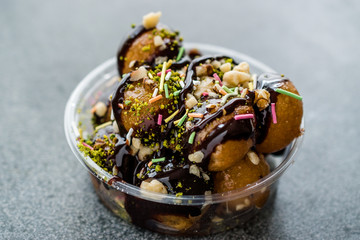 Turkish Dessert Lokma with Chocolate Sauce / Round Fried Dough Balls Petulla.