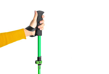 Female hand with walking hiking stick isolated on white background