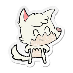 distressed sticker of a cartoon friendly fox