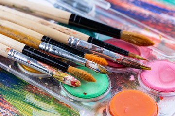 Fototapeta premium Paint brushes and paints for drawing.