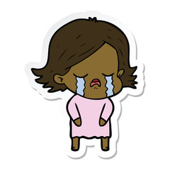 sticker of a cartoon girl crying