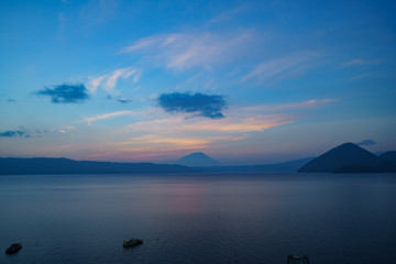 Sunset of the famous Lake Toya with Mount Yotei