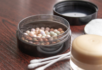 Multicolored concealer powder makeup in black box