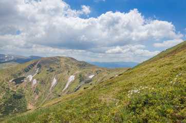 Fototapeta na wymiar spring mountain range with remnants of snow