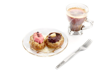 Two cakes and a cup of coffee