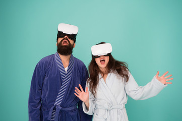 Future life. Good morning. Couple in love. Family. Virtual reality. Love. Happy family in vr glasses. Bearded man and woman in robe pajama. Future is now. Future technology. Vr glasses is our future