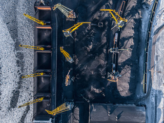 Industrial photo, Loading coal mining in port ship with crane. Aerial top view