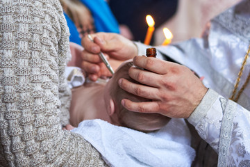 The sacrament of the baptism of the child in the Orthodox Church, the anointing