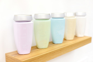 bottles with cosmetics on the shelf for editing. delicate body and face cosmetics