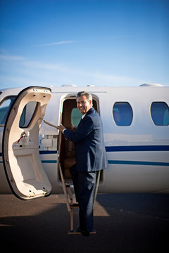 Businessman about to board a private jet