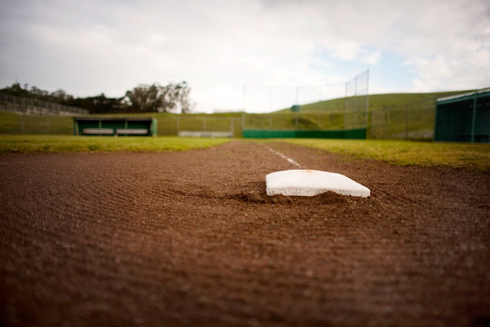 Base in the dirt of a baseball diamond.