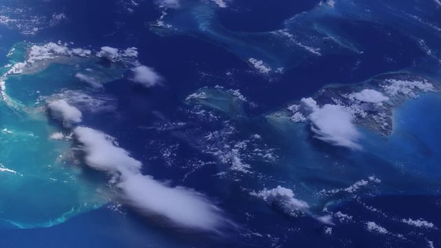 Flight over Bahamas islands satellite view sunrise. Contains public domain image by Nasa