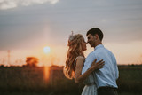 Bride and groom at sunset