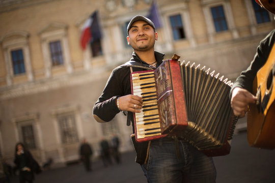 Street musicians performing in a town square.