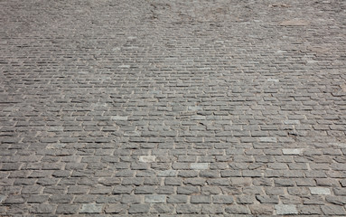 Marble stone paved street, texture background, view from above