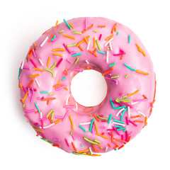 Flat lay pink donut decorated with colorful sprinkles isolated on white background. Sweet donut on...